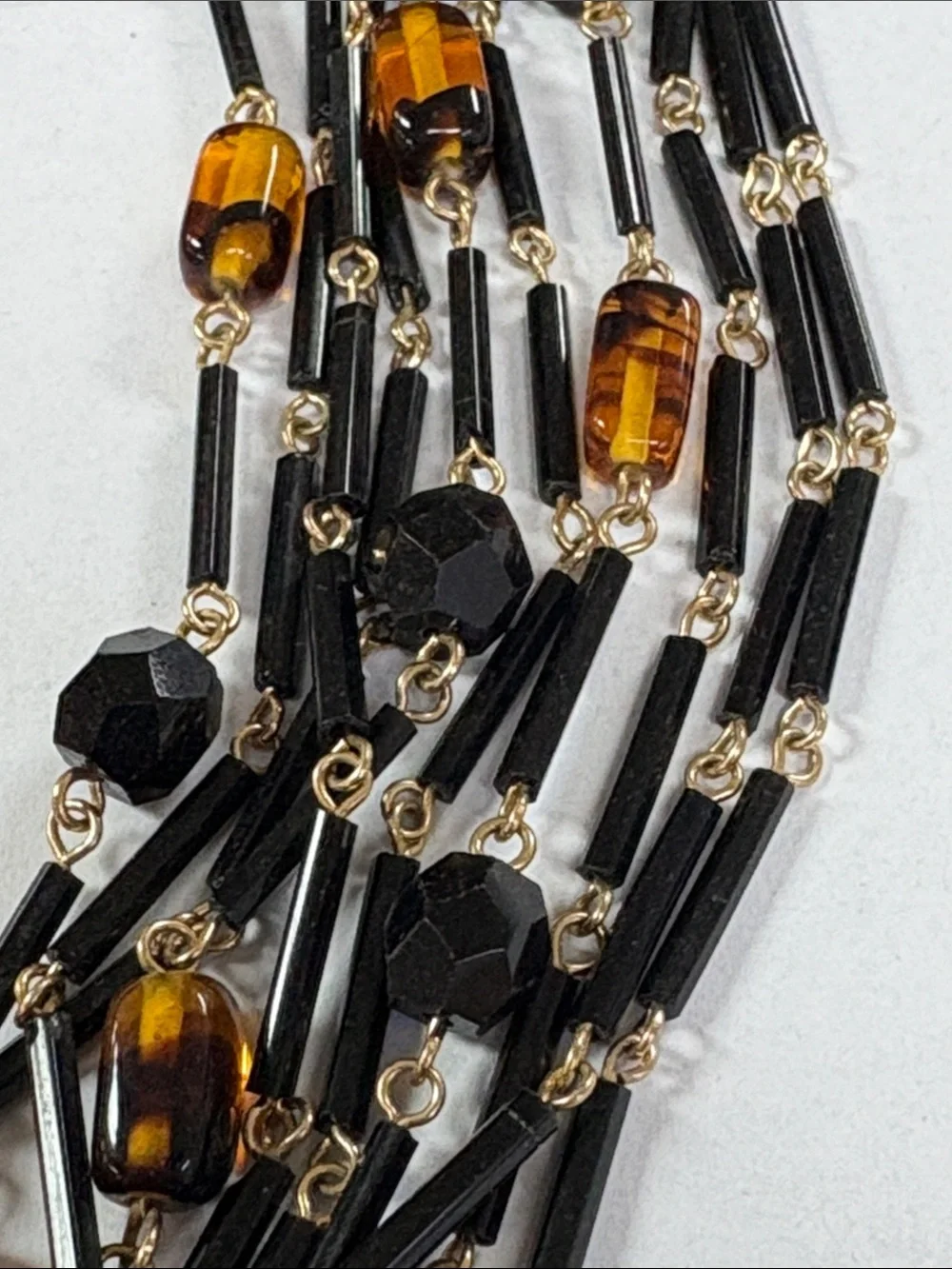 Gold-Accented Black and Amber Multi-Strand Necklace